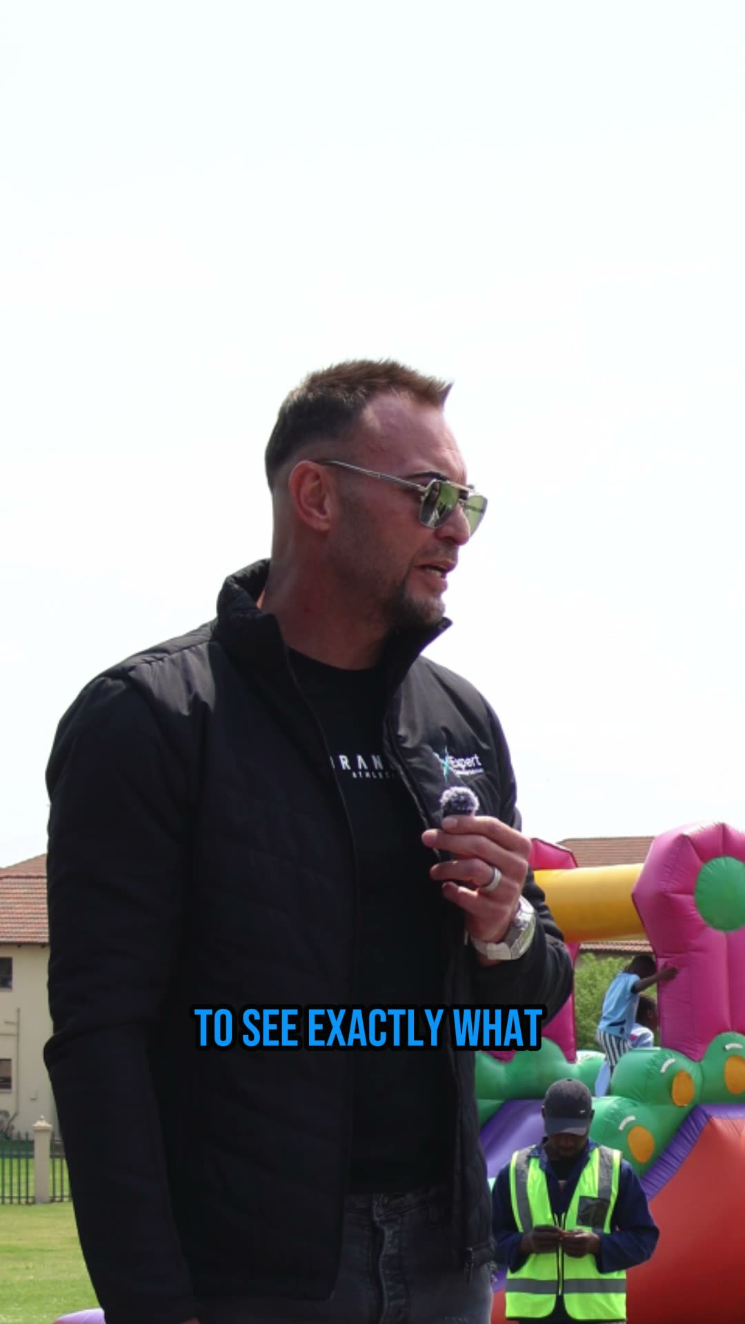 A festival-goer answers a question on camera in bright sunshine.